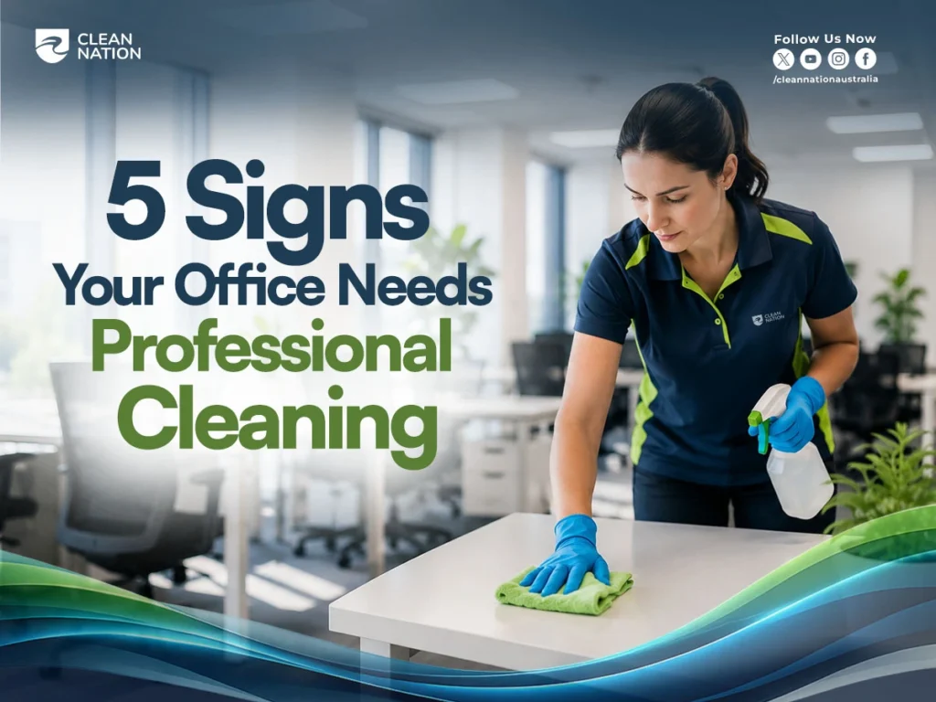 Professional office cleaner sanitising a desk in a modern workplace, highlighting 5 Signs Your Office Needs Professional Cleaning. Clean and organised office environment promoting workplace hygiene, employee health, and professional office cleaning services