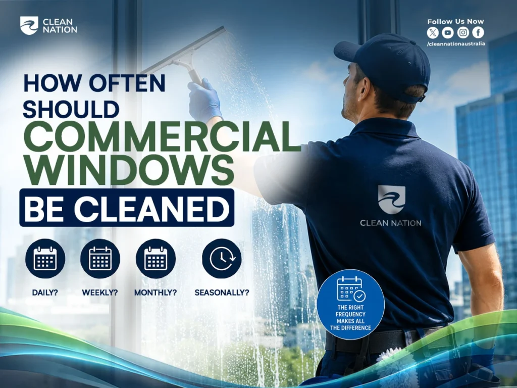 Professional cleaner using a squeegee to clean a commercial office window, explaining What Is Commercial Window Cleaning? while highlighting recommended cleaning schedules, including daily, weekly, monthly, and seasonal maintenance for business windows.