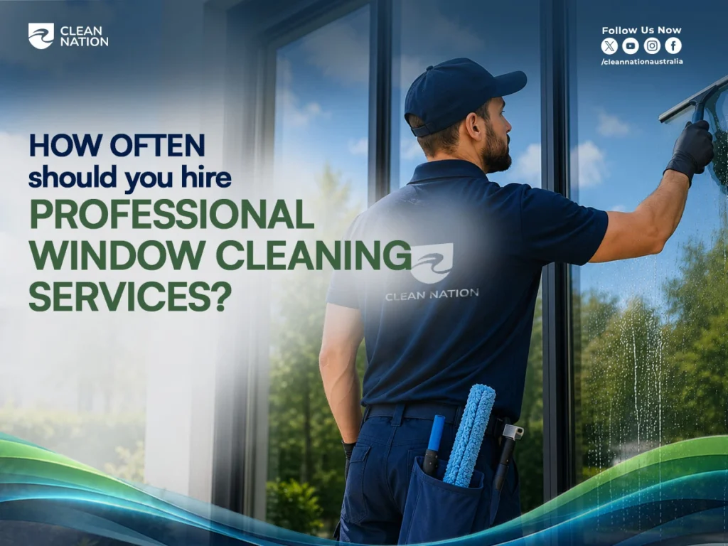 A Clean Nation professional uses a squeegee to clean a large office window, demonstrating Why Is It Important to Hire Professional Window Cleaning Services? for maintaining spotless glass, improving building appearance, and ensuring safe, high-quality window cleaning.
