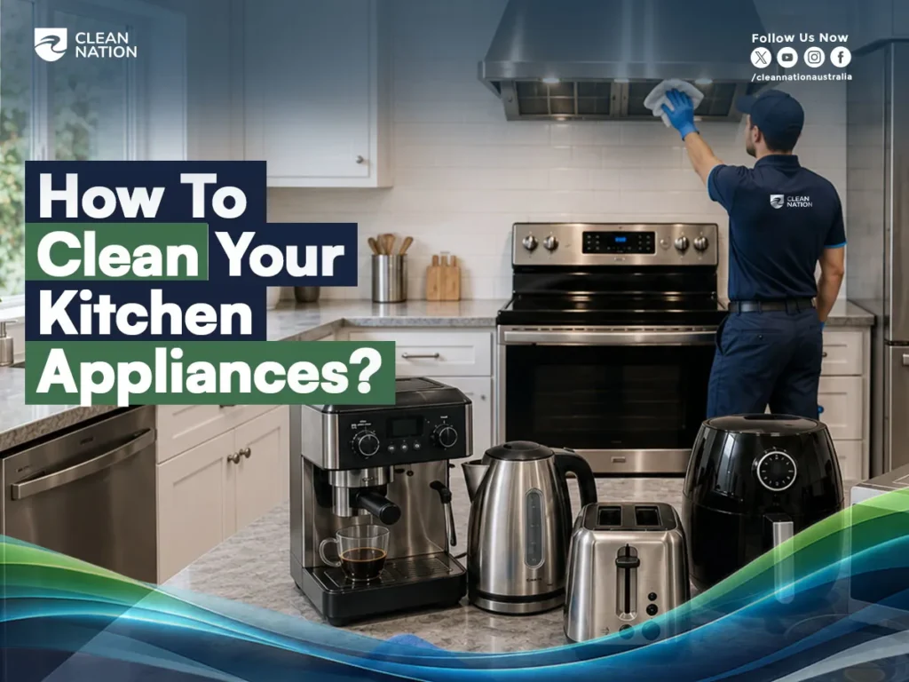 How To Clean Your Kitchen Appliances guide featuring a modern kitchen with a professional cleaner wiping the range hood, alongside an espresso machine, kettle, toaster, and air fryer on the countertop.