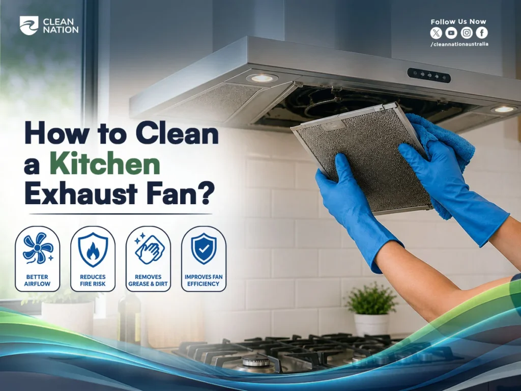 How to Clean a Kitchen Exhaust Fan? A person wearing blue gloves removes and wipes a greasy exhaust fan filter under a stainless-steel kitchen rangehood, highlighting better airflow, reduced fire risk, grease and dirt removal, and improved fan efficiency.