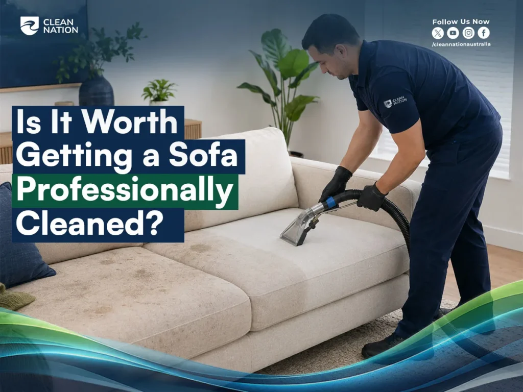 Professional sofa cleaner using an upholstery extraction machine to deep clean a fabric sofa in a modern home.