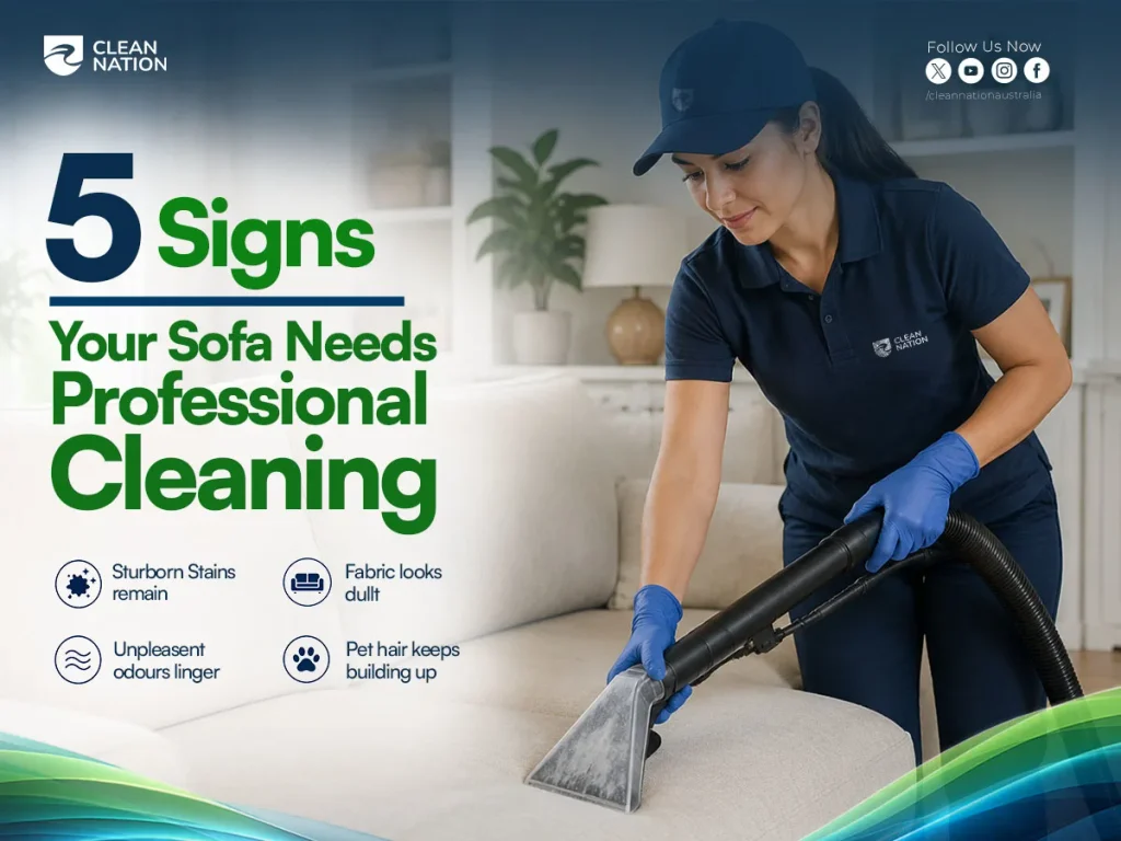 Professional cleaner using an upholstery machine to clean a sofa, highlighting signs that indicate a sofa needs professional cleaning.