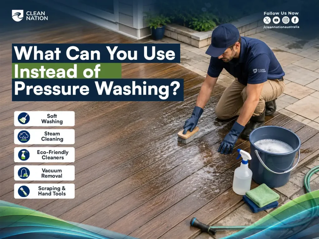 Clean Nation cleaner scrubbing a timber deck using soft washing tools and eco-friendly cleaners as alternatives to pressure washing.
