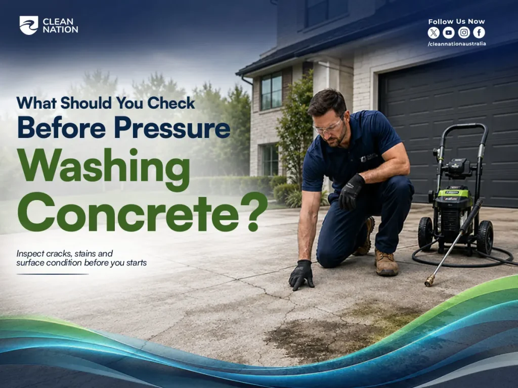 Clean Nation professional inspecting cracks, stains and surface condition on a concrete driveway before pressure washing.