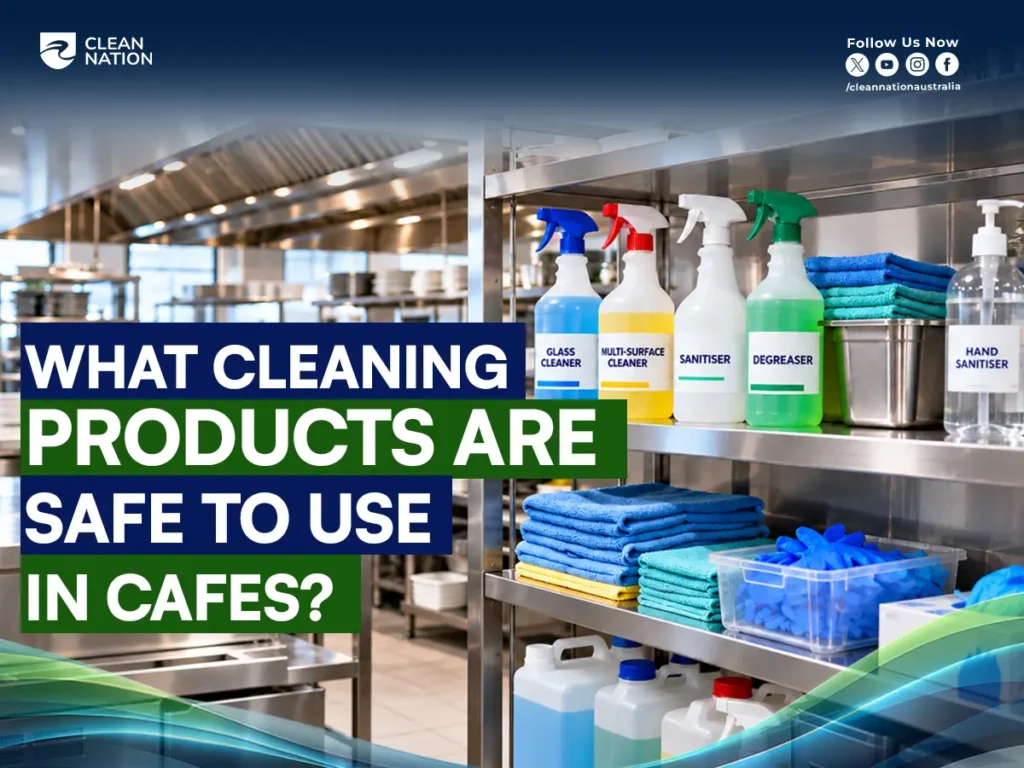 Labelled cafe cleaning products on a stainless steel shelf: glass cleaner, multi-surface cleaner, sanitiser, degreaser and hand sanitiser